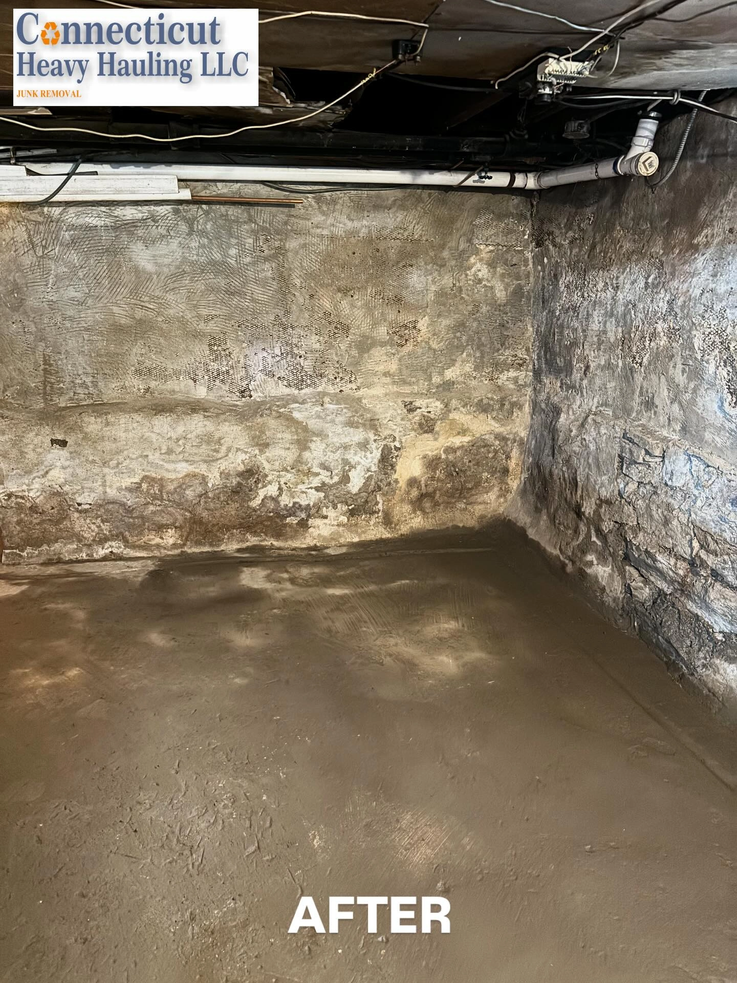 After photo: clean empty room with concrete floor and brick walls cleared by Connecticut Heavy Hauling LLC