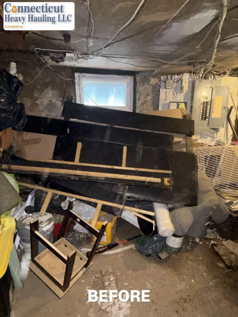 Before cleanup: Cluttered room with old sofas, chairs, and cabinets, ready for removal by Connecticut Heavy Hauling LLC.